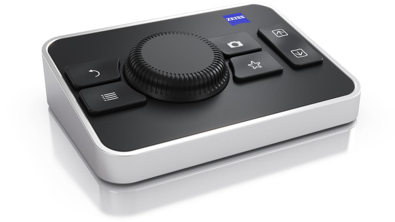 Compact ZEISS control panel with a central dial, five function buttons, and a sleek black-and-silver design.
