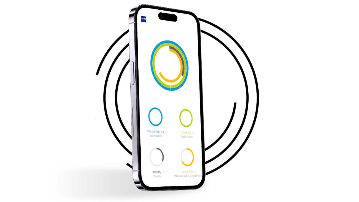 A smartphone in front of black rings shows the vision profile of a My Vision Profile  user with differently coloured rings. 